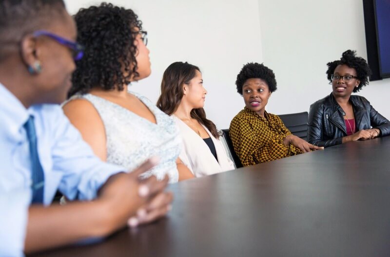 Group of colleagues in discussion during a meeting